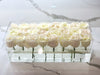 Modern rose box containing two dozen preserved long lasting roses in ivory or white roses