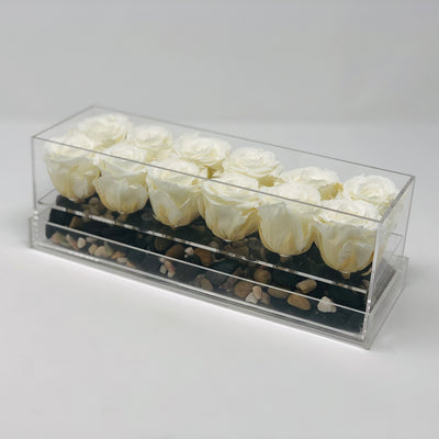 A dozen white forever roses that last for years in a modern acrylic rosebox