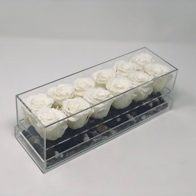 A dozen white forever roses that last for years in a modern acrylic rosebox